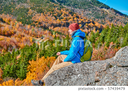 Backpacker man at Artist's Bluff in autumn Backpacker man at Artist's Bluff in autumn 57439479