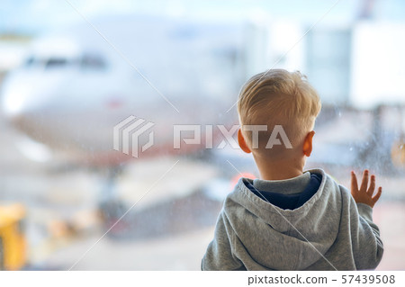 Two year old boy at the airport Two year old boy at the airport 57439508
