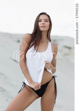 Pretty female in beachwear on nature background 57440128