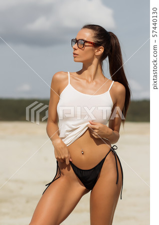 Pretty female in beachwear on nature background 57440130