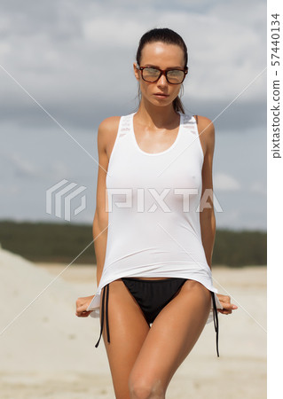 Pretty female in beachwear on nature background 57440134
