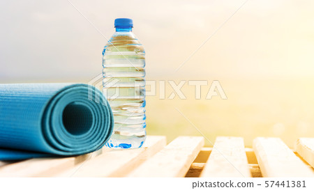 water bottle and sports mat outside 57441381