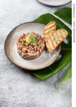 Tuna fish TARTAR tartare on gray plate Tuna fish TARTAR tartare on gray plate 57444641