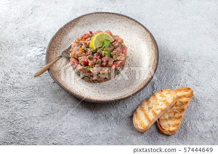 Tuna fish TARTAR tartare on gray plate 57444649