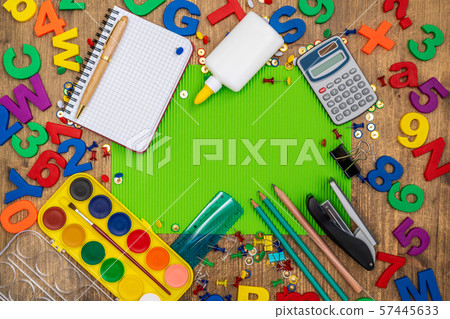 School supplies with green paper sheet 57445633