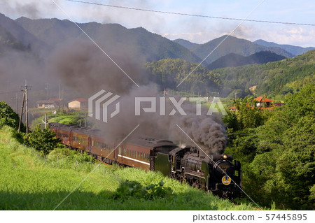 The D51 SL Yamaguchi steam locomotive runs through the mountainous landscape of Yamaguchi Prefecture | Steam locomotive and rural scenery 57445895