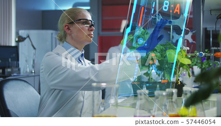 Scientist using a holographic display screen Scientist using a holographic display screen 57446054