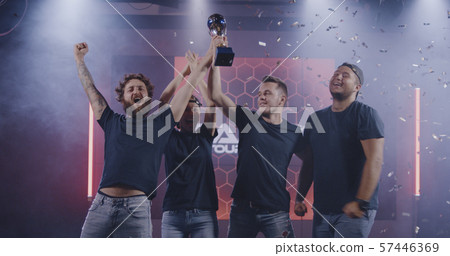 Gaming tournament team celebrating their victory Gaming tournament team celebrating their victory 57446369