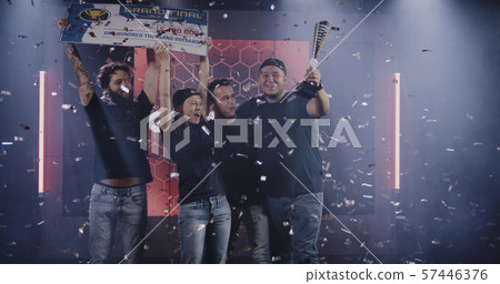Gaming tournament team celebrating their victory Gaming tournament team celebrating their victory 57446376