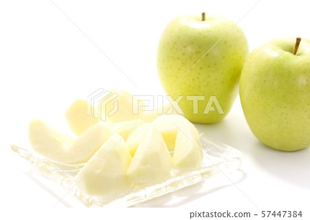 Green apple peeling white background 57447384