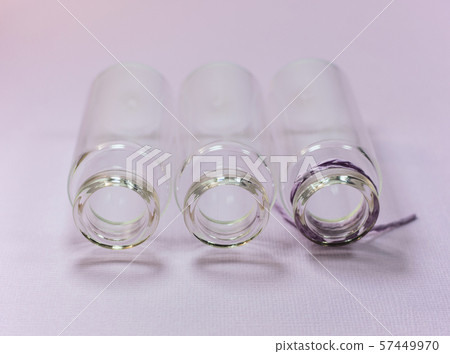 Three empty glass bottles 57449970