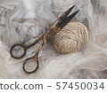 Rusty scissors and a ball of coarse thread 57450034