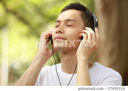 Men listening to music 57450316