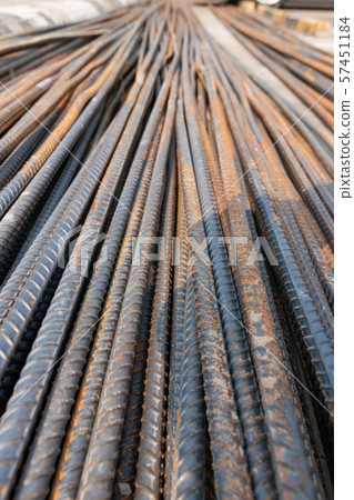 Closeup of concrete reinforcement steel rods in warehouse 57451184