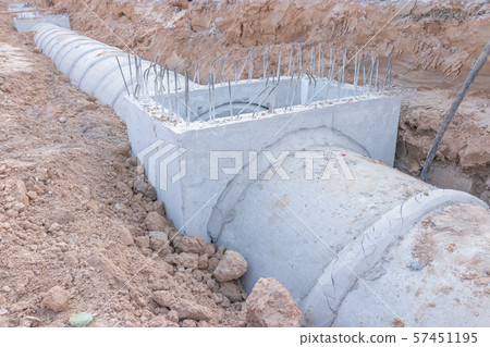 Concrete Drainage Pipe on a Construction Site, Concrete drainage tank on construction site, construction site at the road 57451195
