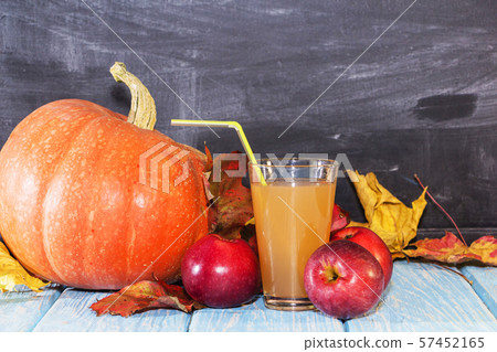 On the table are apples and pumpkins. Autumn still On the table are apples and pumpkins. Autumn still 57452165
