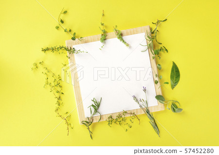 Recipe Design Template. A clipboard with aromatic cooking herbs, shot from the top on a yellow 57452280