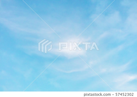 Abstract background of a vibrant clear blue turquoise sky with soft white clouds 57452302