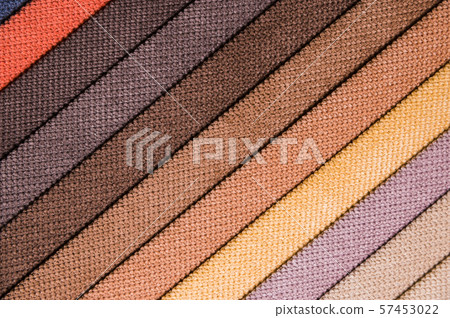 Colorful and bright fabric samples of furniture and clothing upholstery. Close-up of a palette of Colorful and bright fabric samples of furniture and clothing upholstery. Close-up of a palette of 57453022