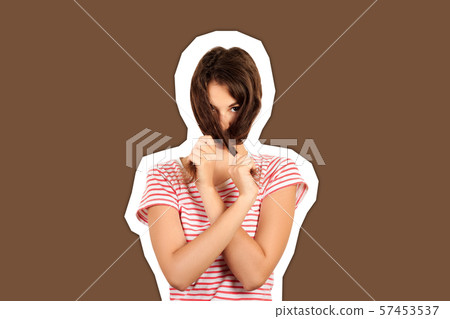 portrait of brunette woman playing with her long 57453537