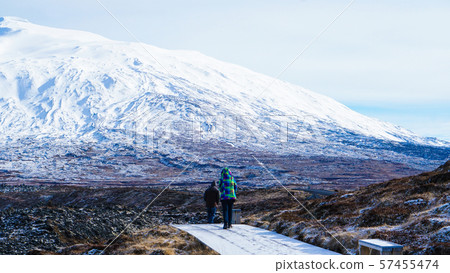 Tourist walk in Iceland volcanic landscape 57455474