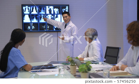 Medical concept. The young doctor is offering a Medical concept. The young doctor is offering a 57456250