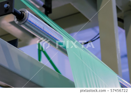 Automatic plastic bag making machine - roller with green polyethylene film Automatic plastic bag making machine - roller with green polyethylene film 57456722