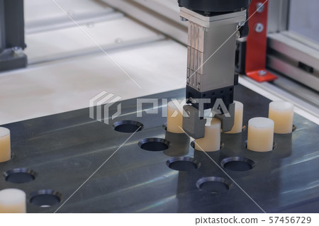 Automated robotic clamp arm, robot hand during work at exhibition, close up Automated robotic clamp arm, robot hand during work at exhibition, close up 57456729