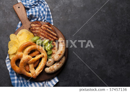 Oktoberfest set. Pretzels, sausages and chips 57457136