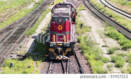 Locomotive on the rails of a metallurgical factory. Locomotive on the rails of a metallurgical factory. 57457213