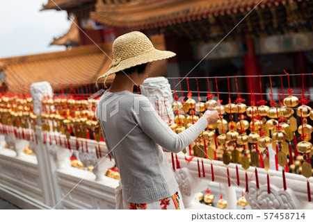 woman look at the golden bells 57458714