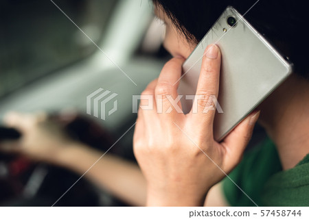 woman talking on cellphone when driving woman talking on cellphone when driving 57458744