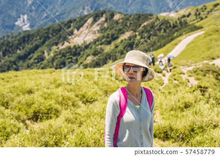 Asian mountain climbing woman Asian mountain climbing woman 57458779