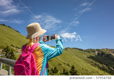 Asian climbing woman take pictures Asian climbing woman take pictures 57458780