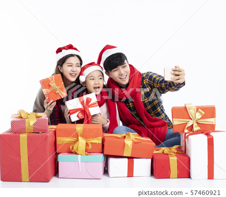 happy family taking selfie and showing christmas 57460921