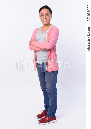 Full body shot of happy Japanese man smiling with arms crossed Full body shot of happy Japanese man smiling with arms crossed 57461653