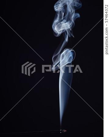 Abstract swirl of white smoke from burning incense 57464372