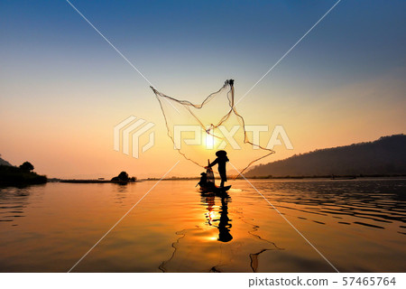 Asia fisherman net using on wooden boat casting Asia fisherman net using on wooden boat casting 57465764