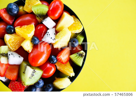 Fruit salad bowl fresh summer fruits and Fruit salad bowl fresh summer fruits and 57465806