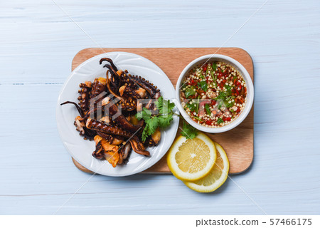 Octopus salad with lemon herbs and spices on white Octopus salad with lemon herbs and spices on white 57466175