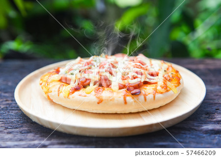 pizza cheese sauce top view on rustic wood 57466209