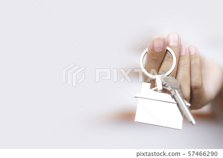 Female hand holding house key ,buying selling property business Female hand holding house key ,buying selling property business 57466290