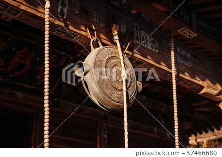 Japanese bronze shinto bell hanging at Shrine. 57466680