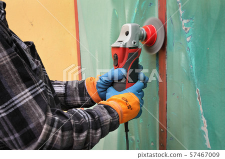 Old metal door repairing, rust and paint cleaning 57467009