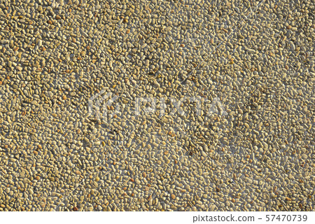Pebbles pathway pattern in concrete. 57470739