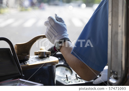 Hands driving a tram 57471093