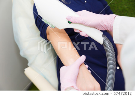 Hair depilation in the beauty salon. Laser hair Hair depilation in the beauty salon. Laser hair 57472012