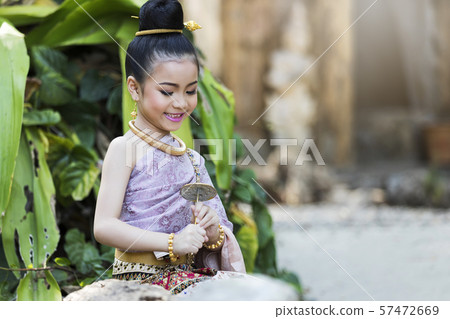 Beautyful Thai girl wearing thai traditional clothing. Beautyful Thai girl wearing thai traditional clothing. 57472669