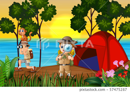 The explorer boys camping by the lake at sunset The explorer boys camping by the lake at sunset 57475287
