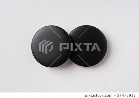 top view of black badge on grey background top view of black badge on grey background 57475912